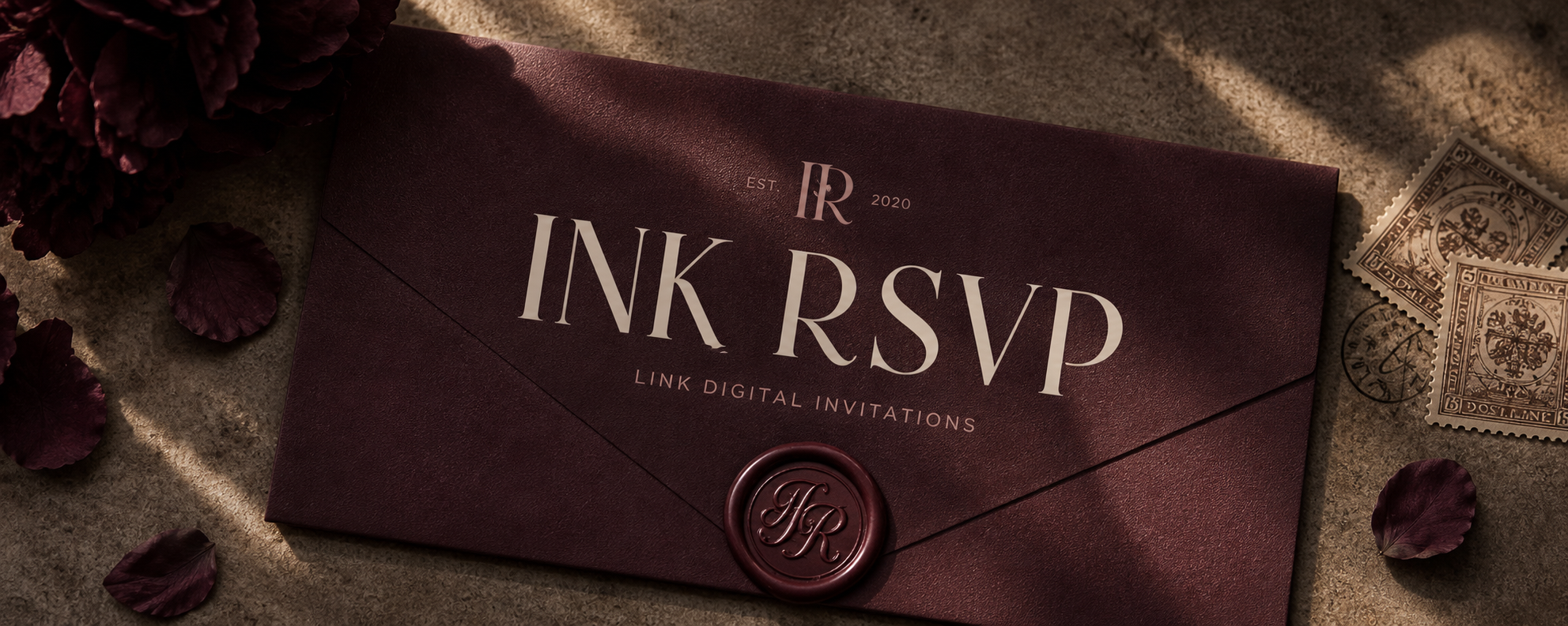 Ink RSVP burgundy invitation envelope with wax seal and dried petals